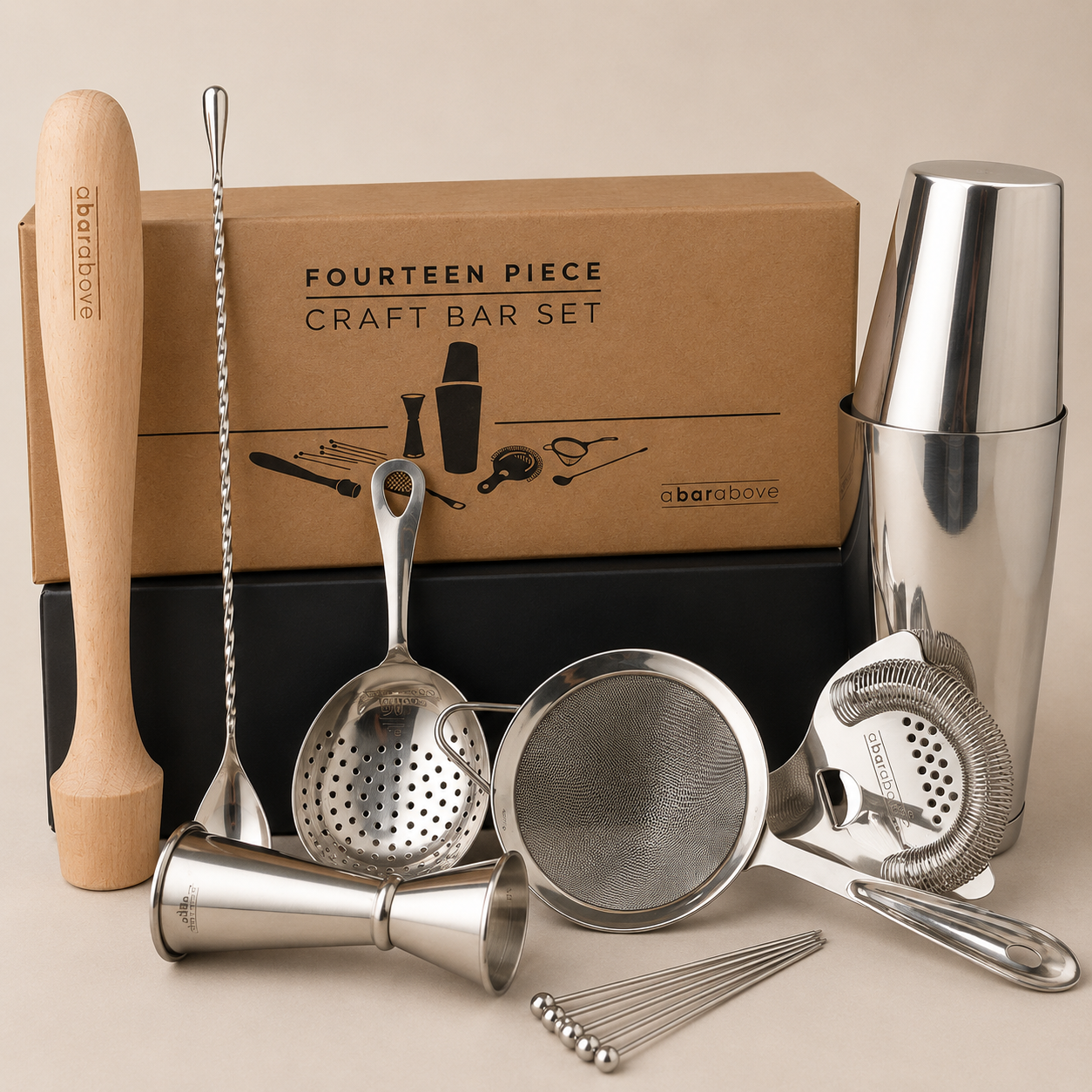 Fourteen-piece craft bar set with cocktail shaker, jigger, strainers, muddler, and bar spoon in a kraft gift box